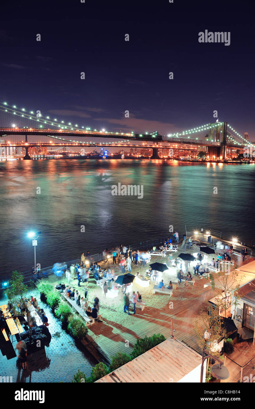 Brooklyn Bridge over East River at night in New York City Manhattan ...