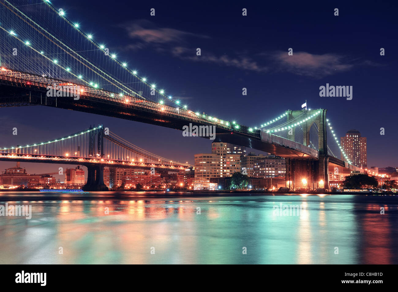 Brooklyn Bridge over East River at night in New York City Manhattan ...