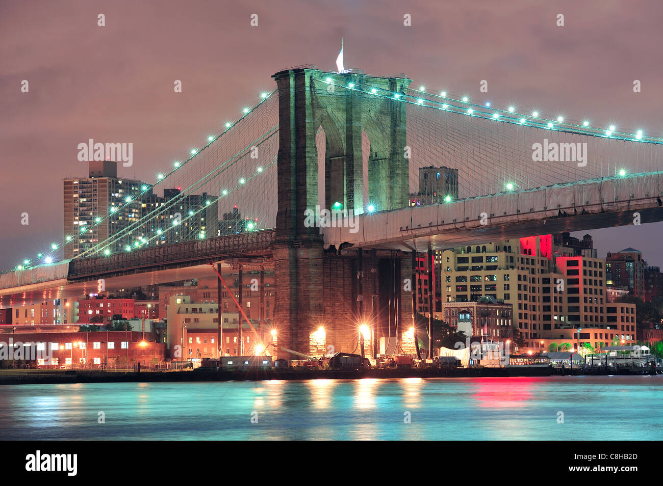 Brooklyn Bridge over East River at night in New York City Manhattan ...