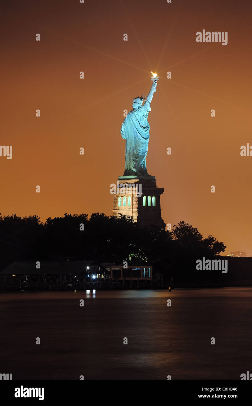 Statue of Liberty at night lit by lights in Liberty Park in New York City  Stock Photo - Alamy