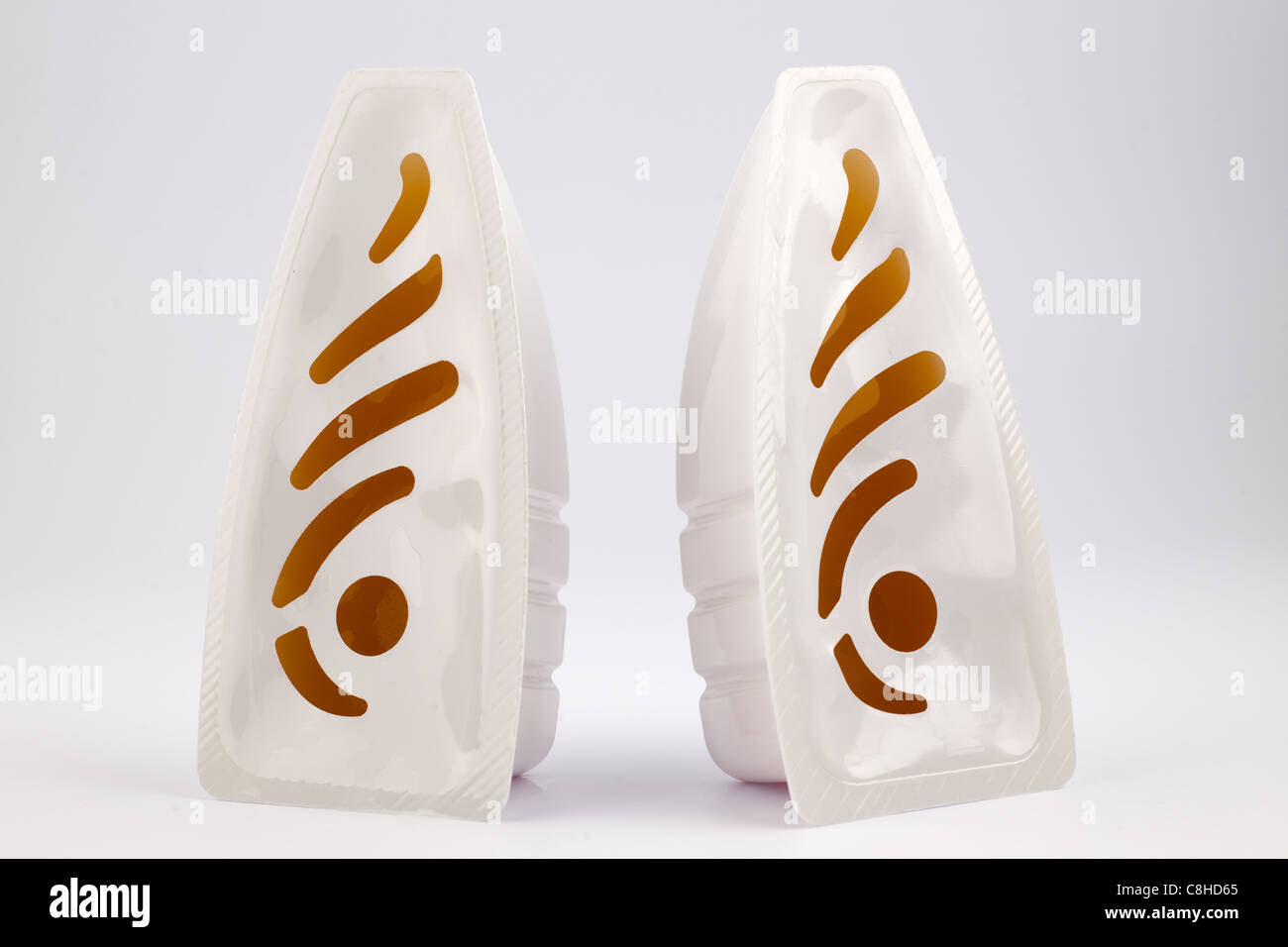 Two gel plastic contained air fresheners Stock Photo Alamy