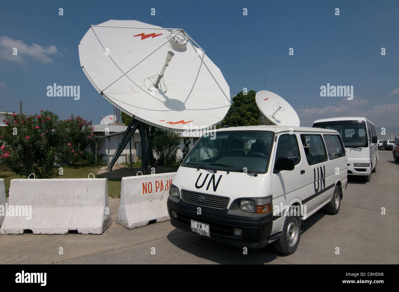 UN minibuses lined at the compound of the United Nations Stabilization Mission in Haiti (MINUSTAH) in Port au Prince in Haiti Stock Photo