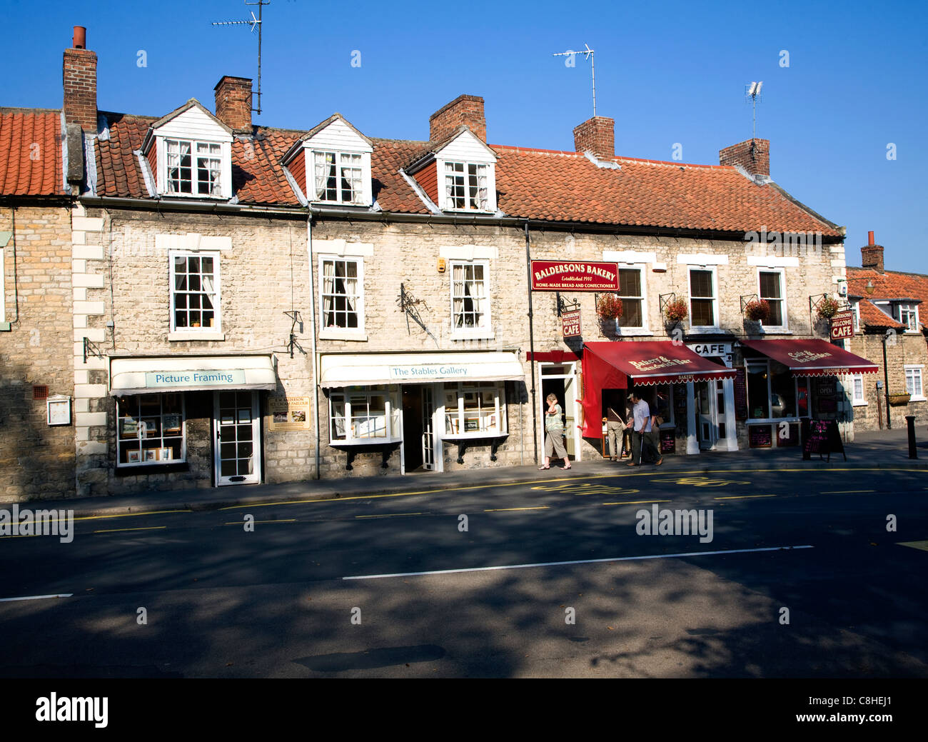 Shops and houses in the village street, Thornton le Dale, Yorkshire, England Stock Photo