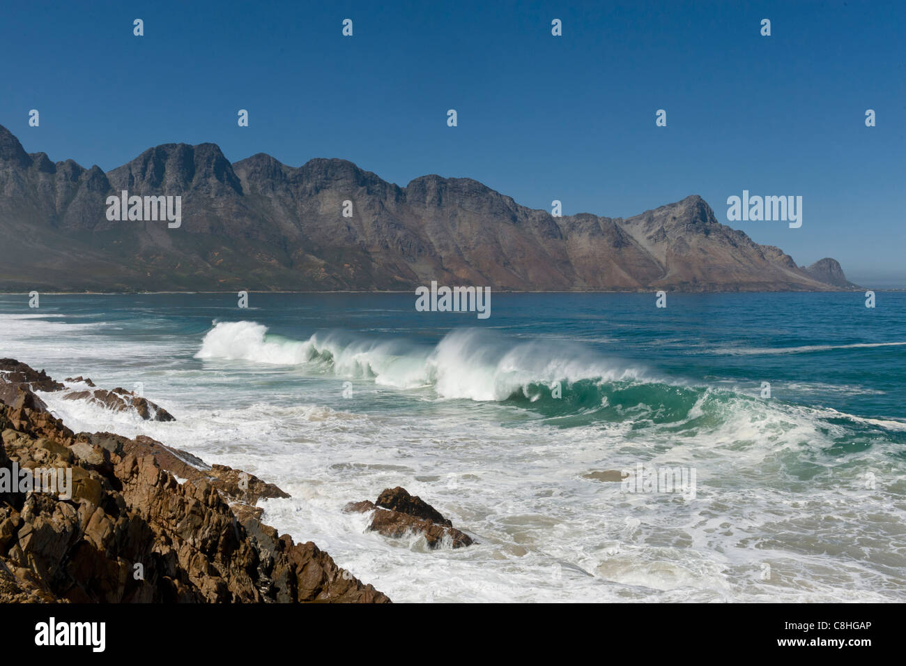 Waves crushing on the boulders along Route 44 Western Cape South Africa Stock Photo
