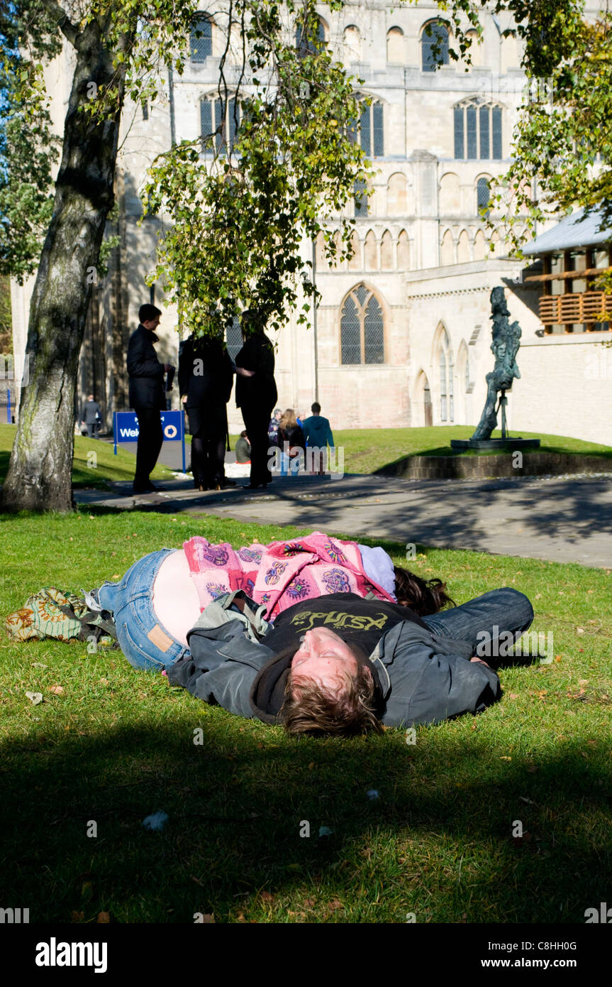 Two drunks passed out on each other on a hot day in Norwich Stock Photo
