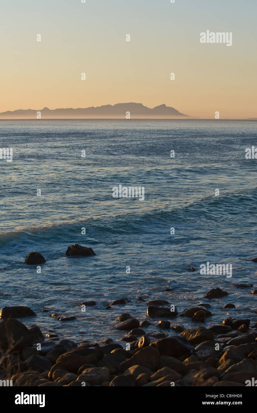 View across false bay towards Table Mountain at sunset Route 44 Western Cape South Africa Stock Photo