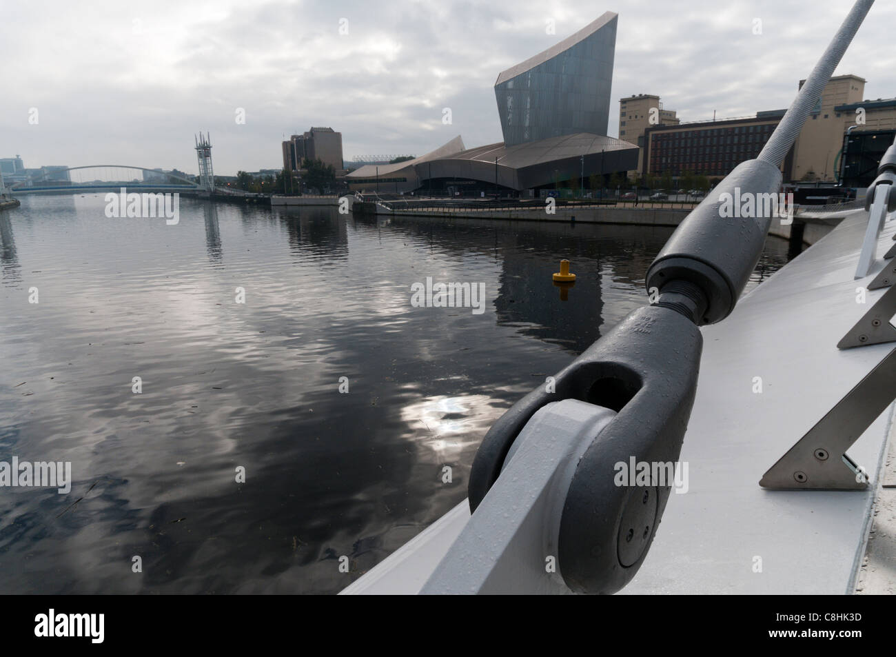 Imperial War Museum North seen across the Manchester Ship Canal from the Media City Swing Bridge at Salford Quays. Stock Photo