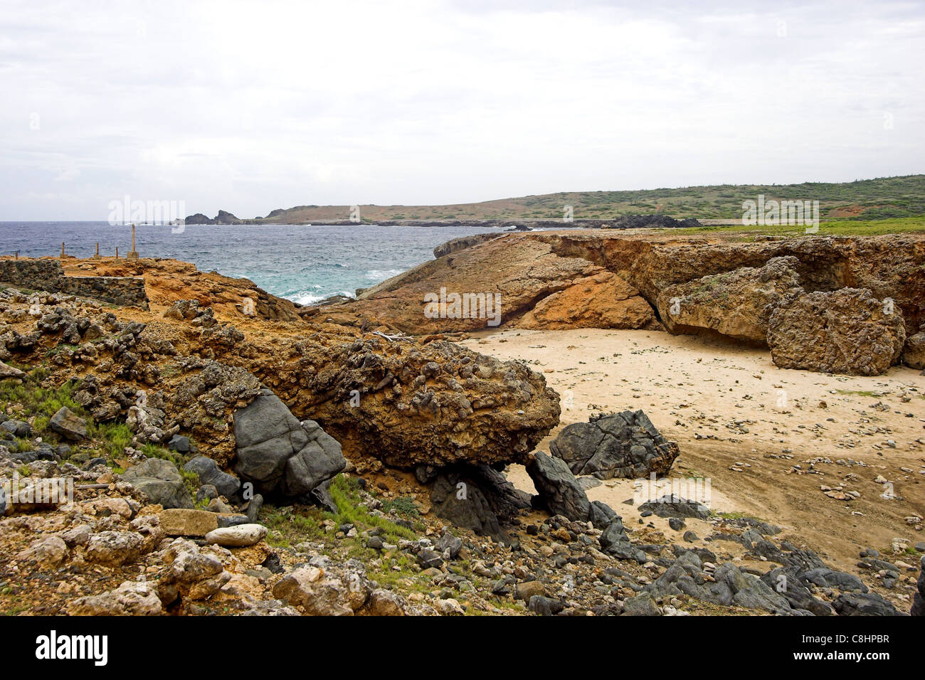 Collapsed natural bridge on the rugged North coast of Aruba Stock Photo