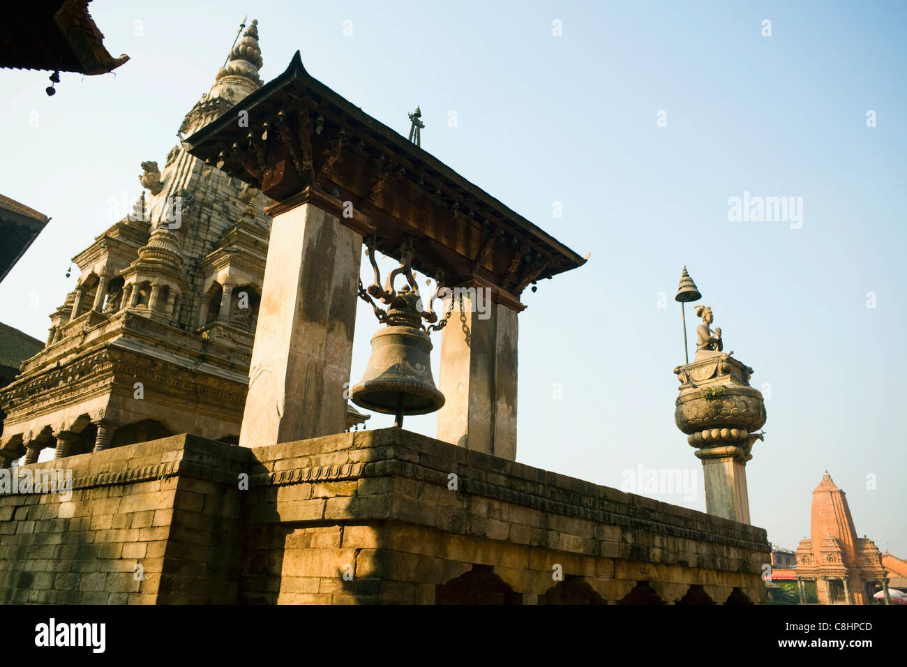 Taleju Bell and Vatsala Durga Temple at Bhaktapur's Durbar Square in the Kathmandu Valley, Nepal Stock Photo