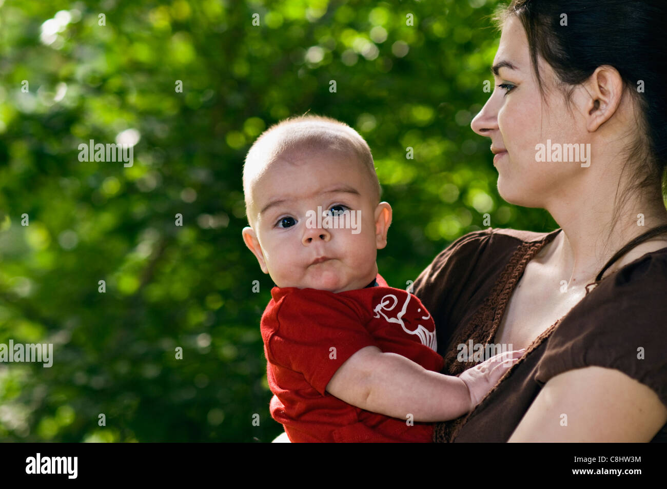 Young Mother Holding 5 Month Old Son Stock Photo