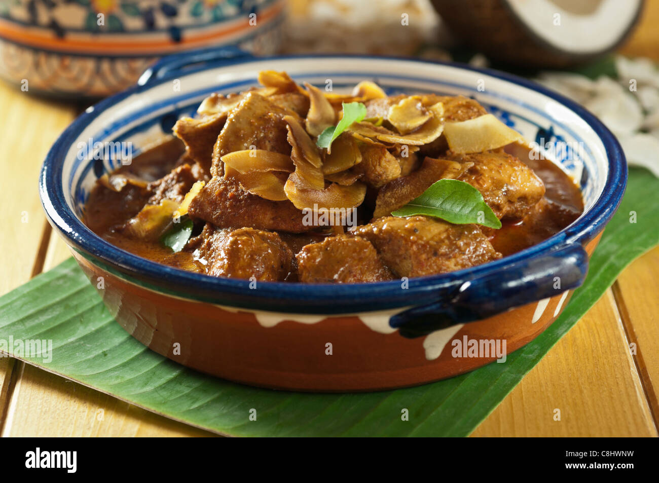 Chicken xacuti with coconut rice. Western India Food Stock Photo