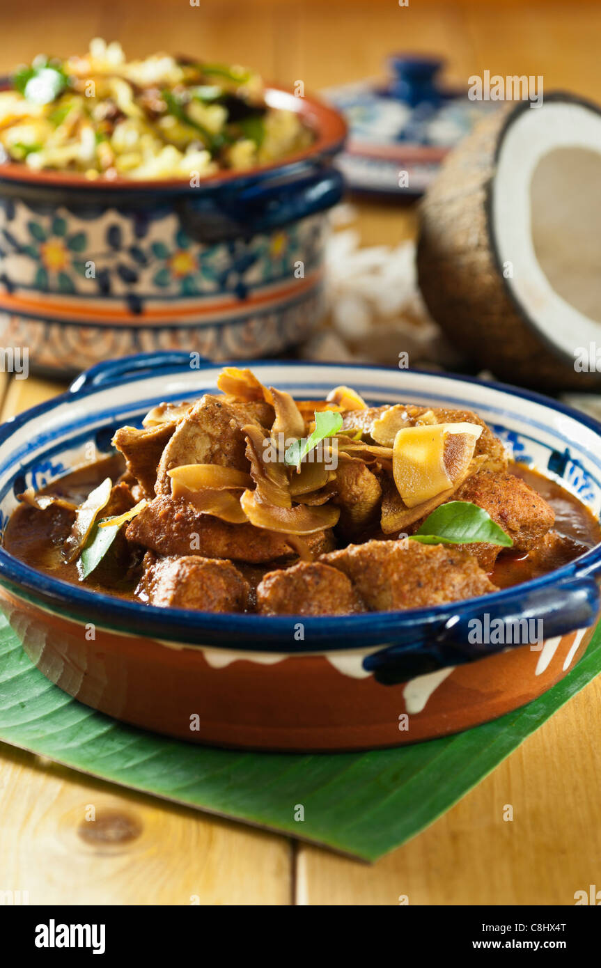 Chicken xacuti with coconut rice. Western India Food Stock Photo
