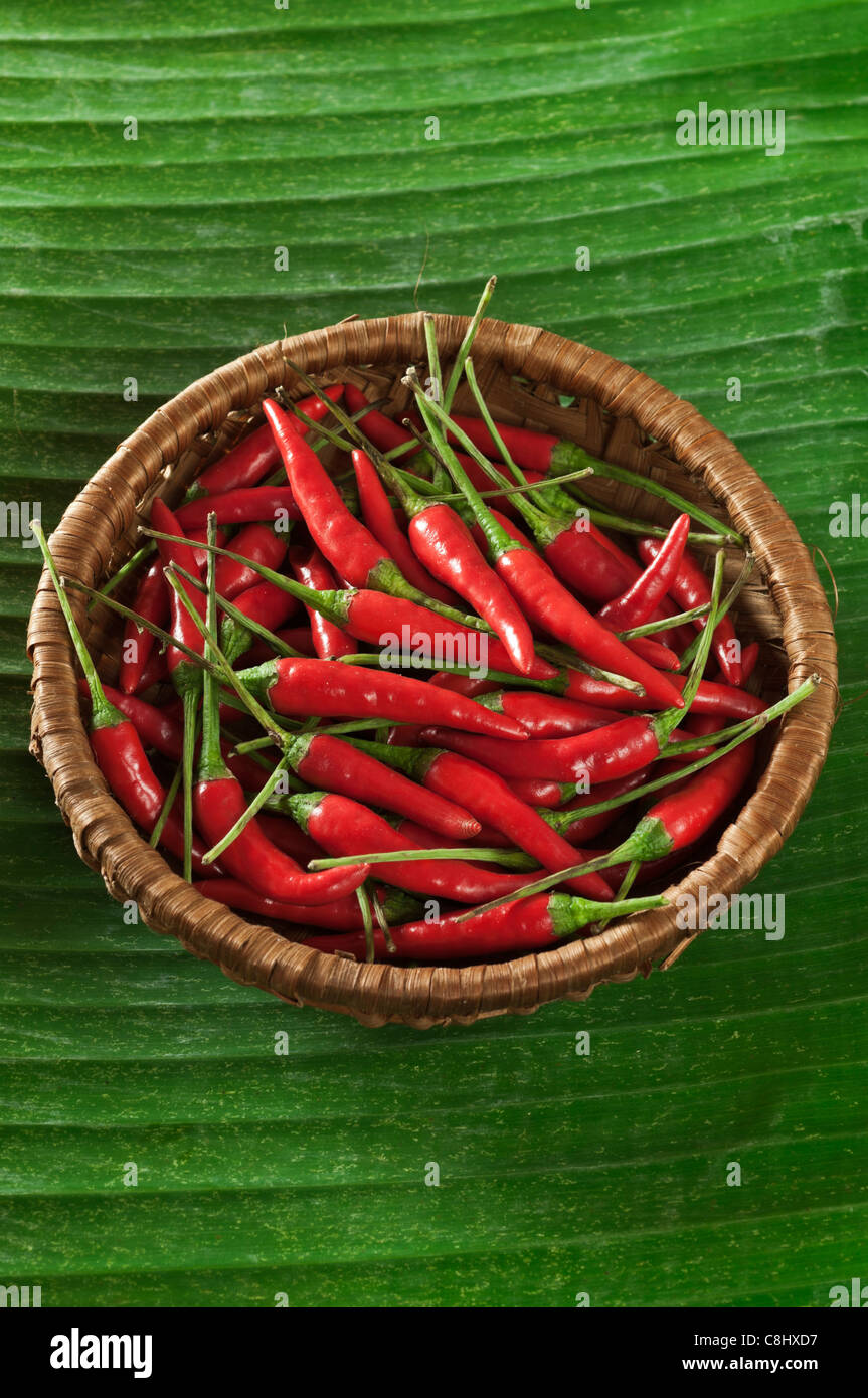 Red chillies on banana leaf Stock Photo