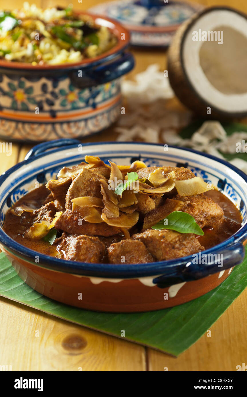 Chicken xacuti with coconut rice. Western India Food Stock Photo
