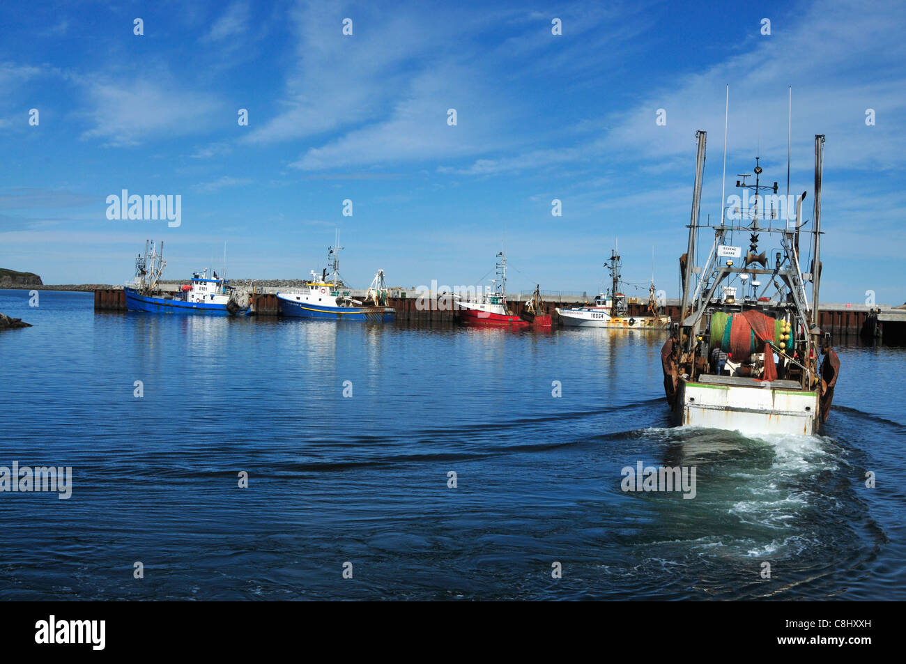 Fishing trawlers in Riviere aux Renard, Quebec, Canada wait in port before going to fish. Stock Photo