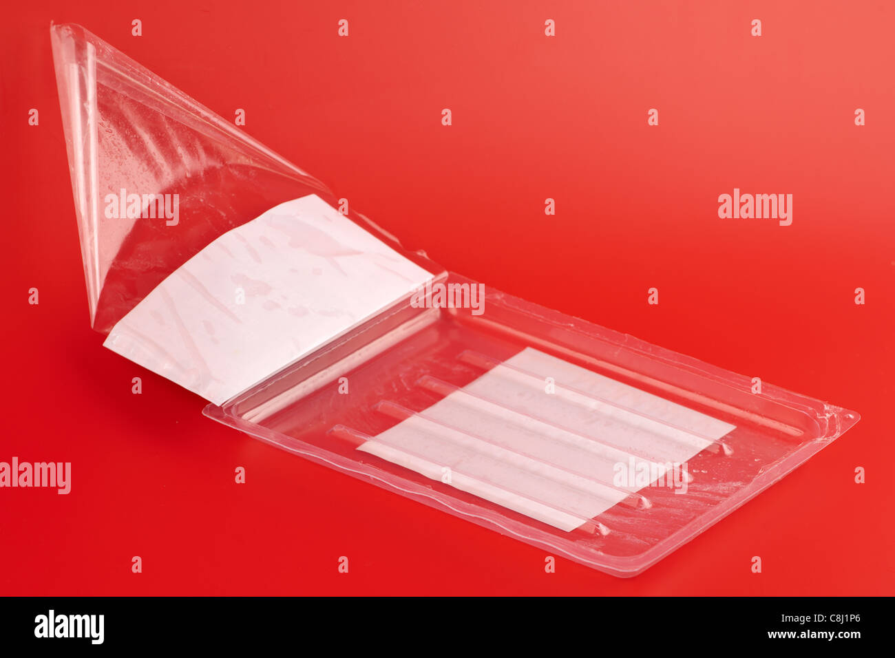 Empty clear plastic packaging tray for rashers of bacon Stock Photo