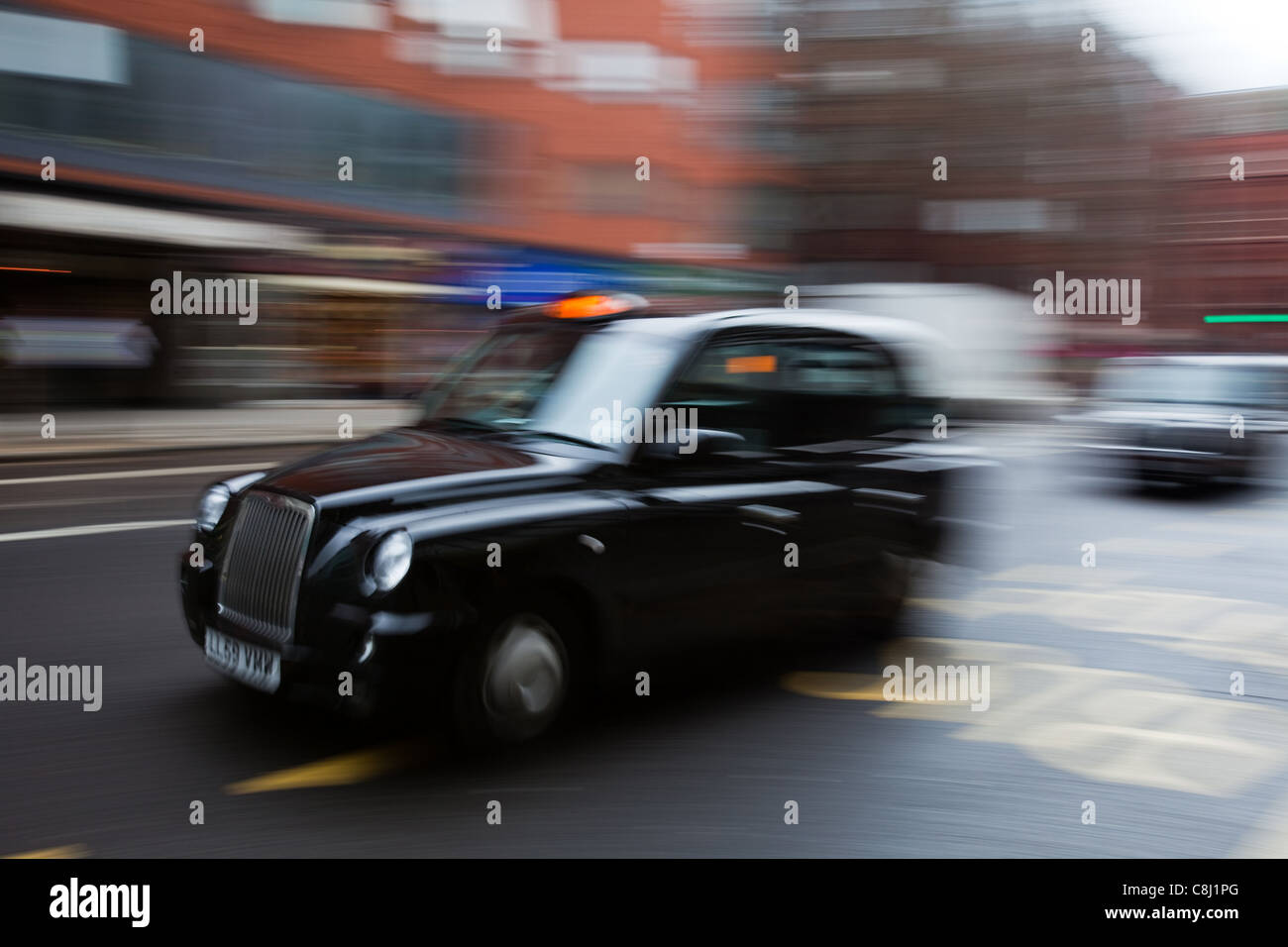 London black cab: Taxi for hire sign illuminated Stock Photo
