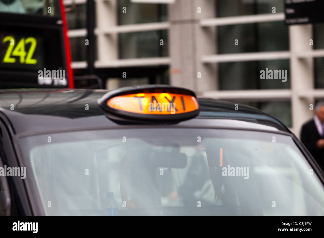 London black cab: Taxi for hire sign illuminated Stock Photo