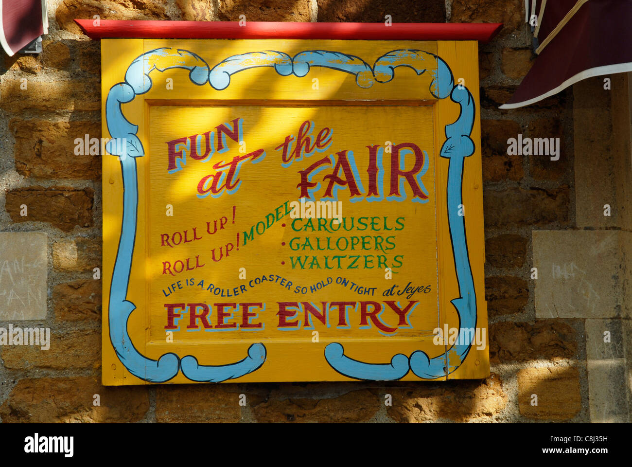 Fun fair sign on a wall at Earls Barton, Northants. Stock Photo