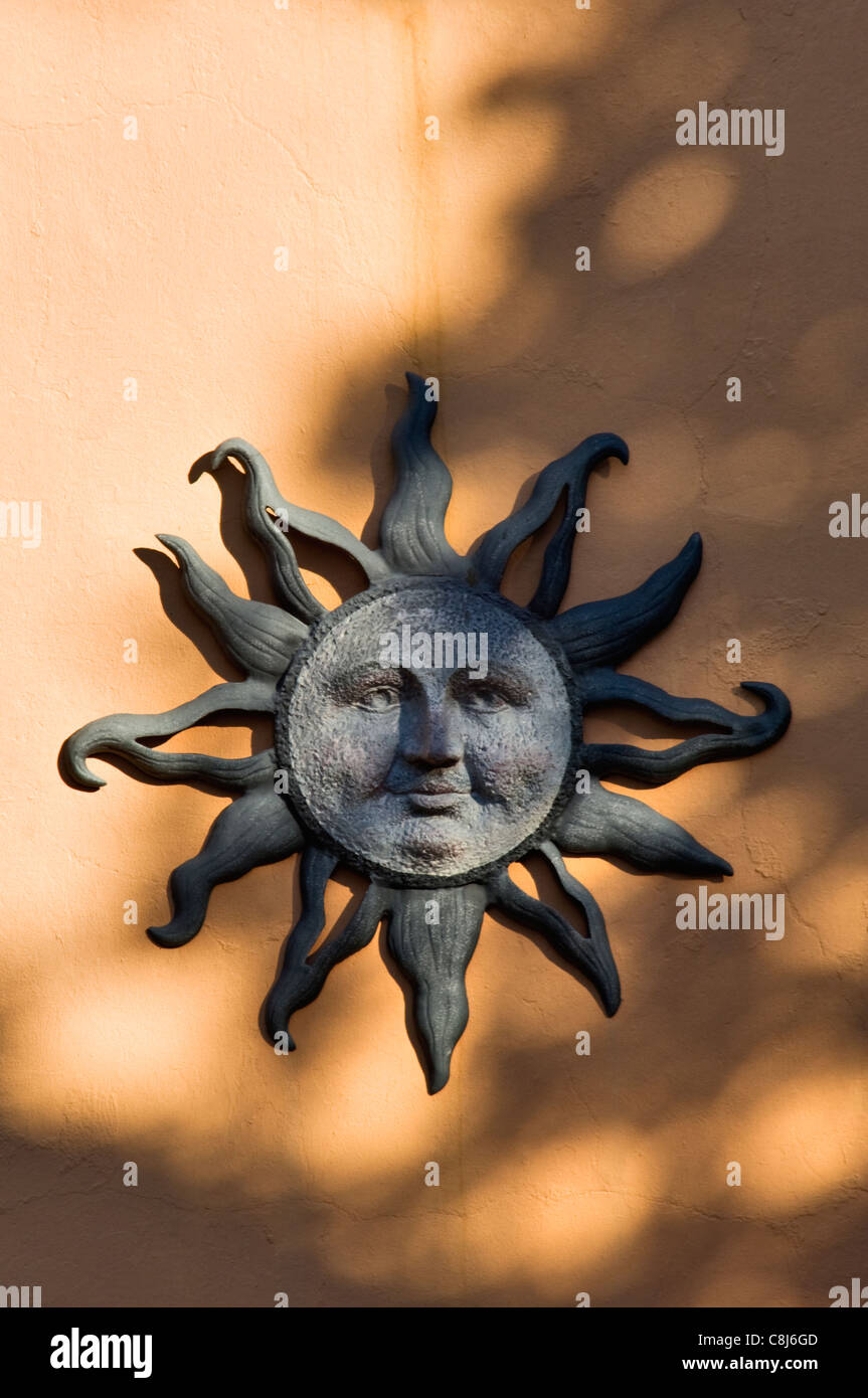 Sun Decoration on the Side of a Stuccoed House in Madison, Indiana Stock Photo