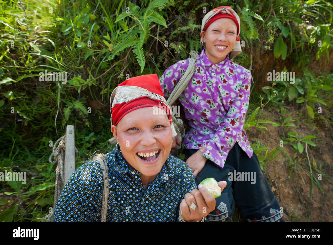 Two Red Dao woman with traditional shaved eyebrows. North Vietnam Stock Photo