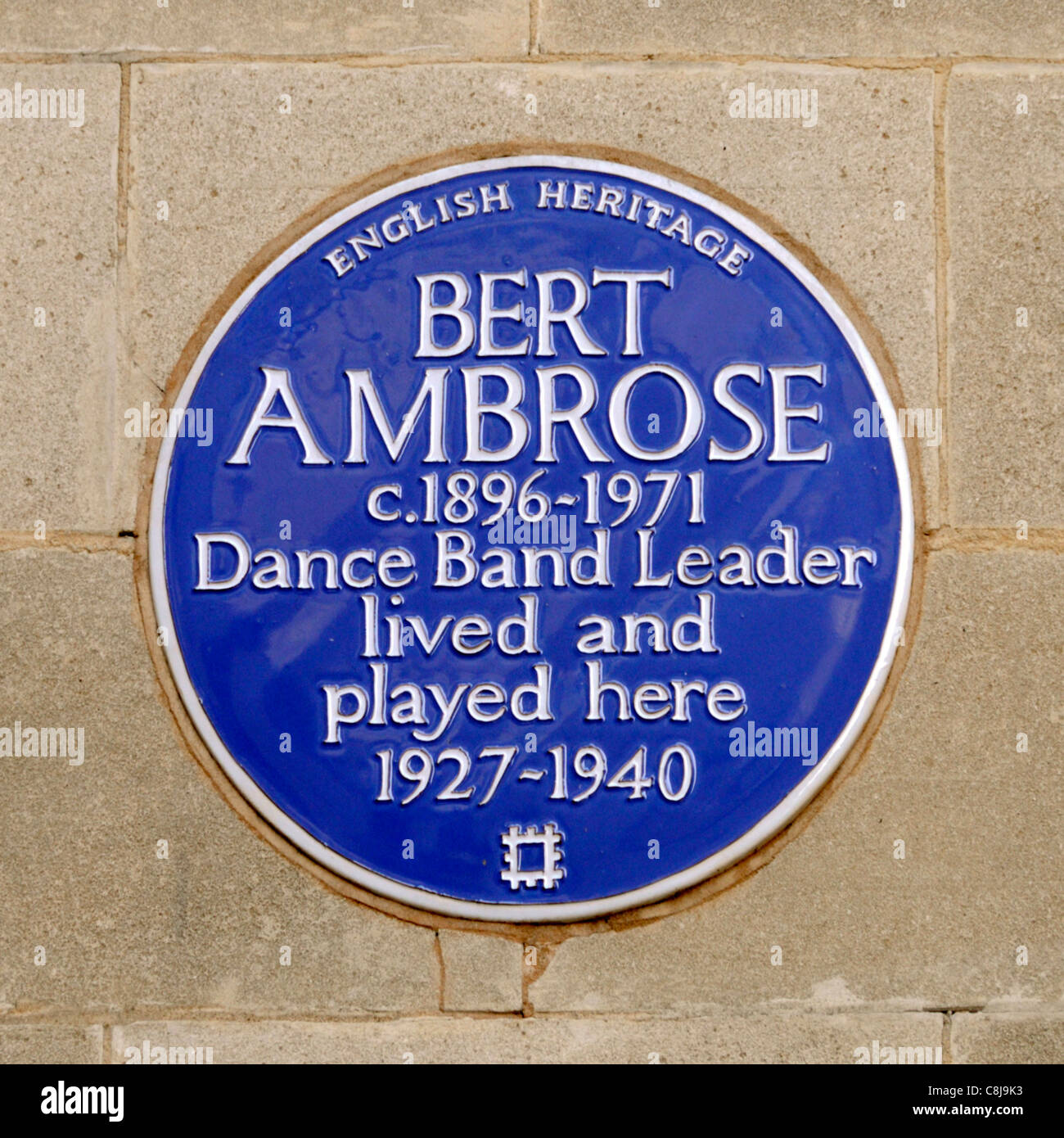 English Heritage blue plaque remembering English Musician Bert Ambrose who lived and played here Stratton Street Mayfair London West End England UK Stock Photo