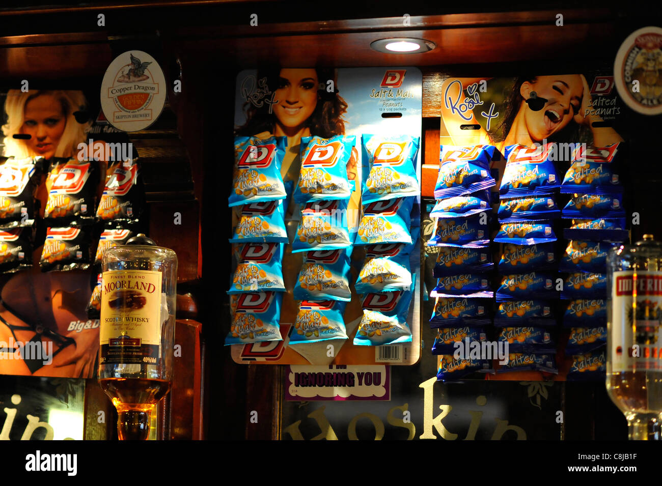 Nuts and bar snacks behind a pub bar Stock Photo Alamy
