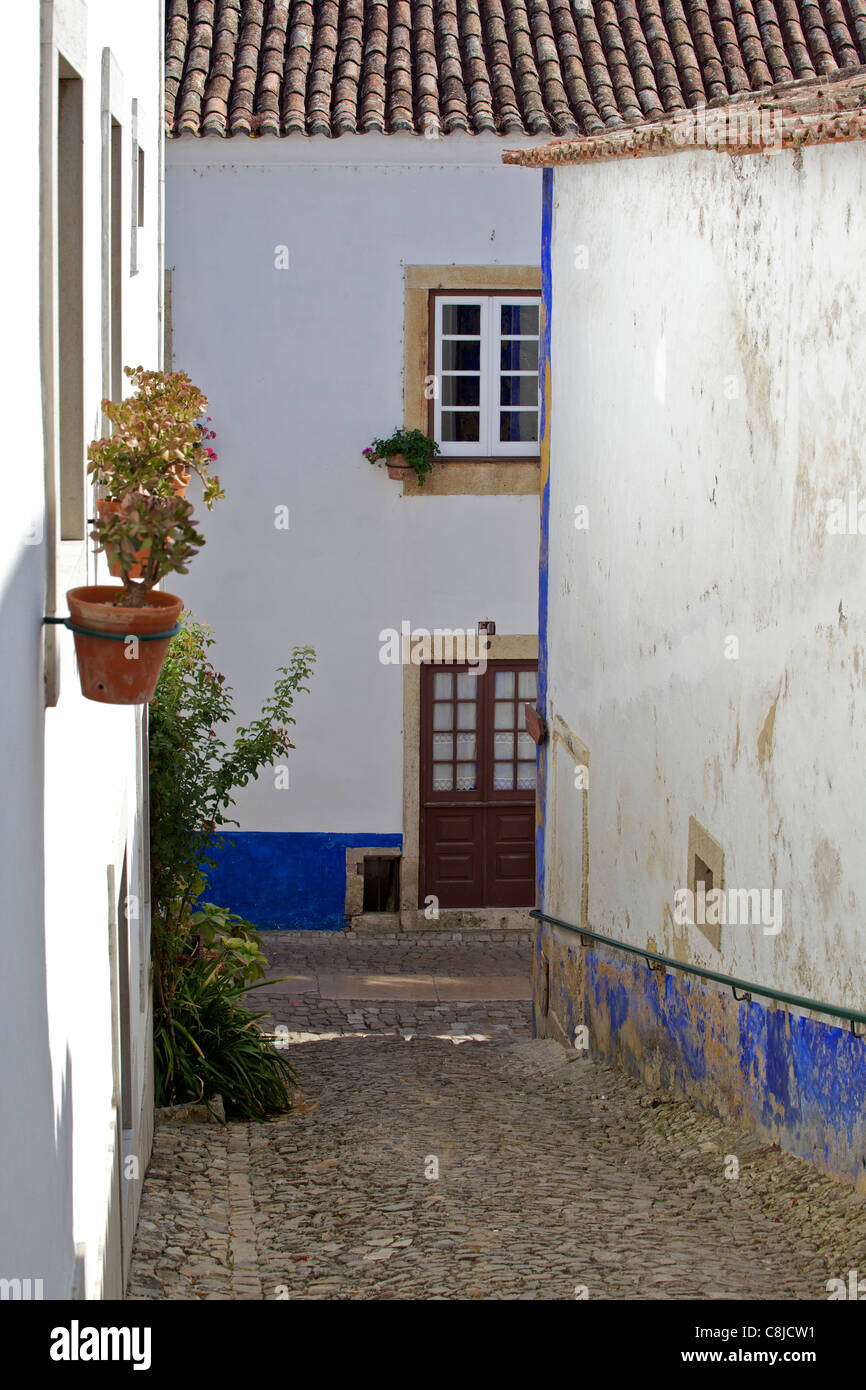 Secluded Cobblestone Street in the Medieval Village of Obidos Stock Photo