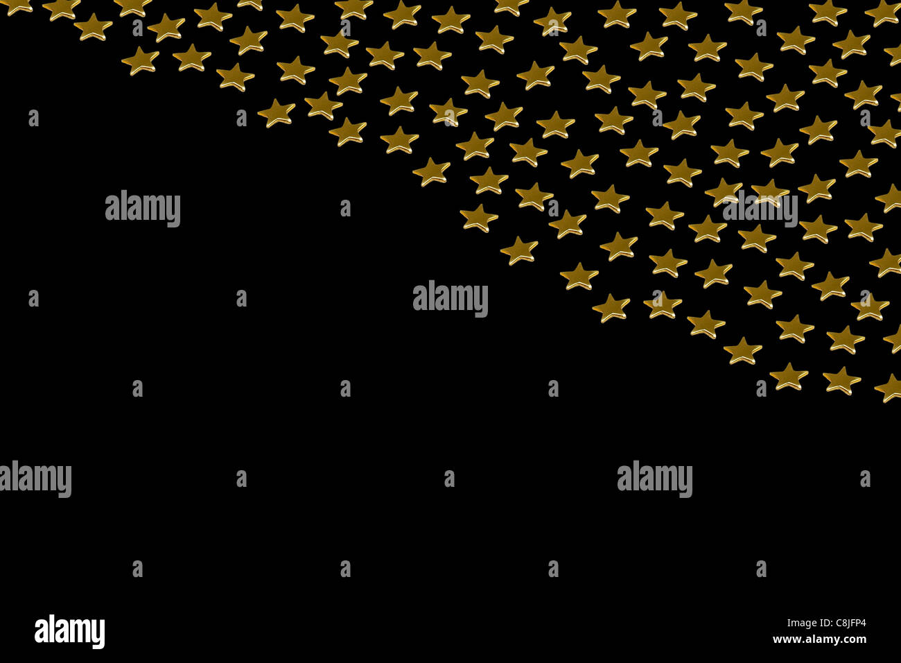 Closeup of many golden stars on black background Stock Photo - Alamy