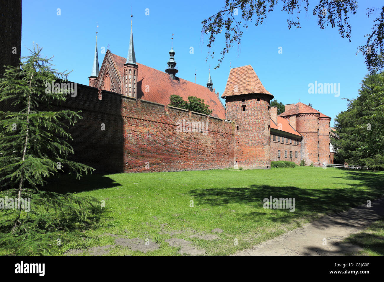 Nicolaus Copernicus Monument in the background of the cathedral in Frombork, a place where he worked Copernicus. Stock Photo