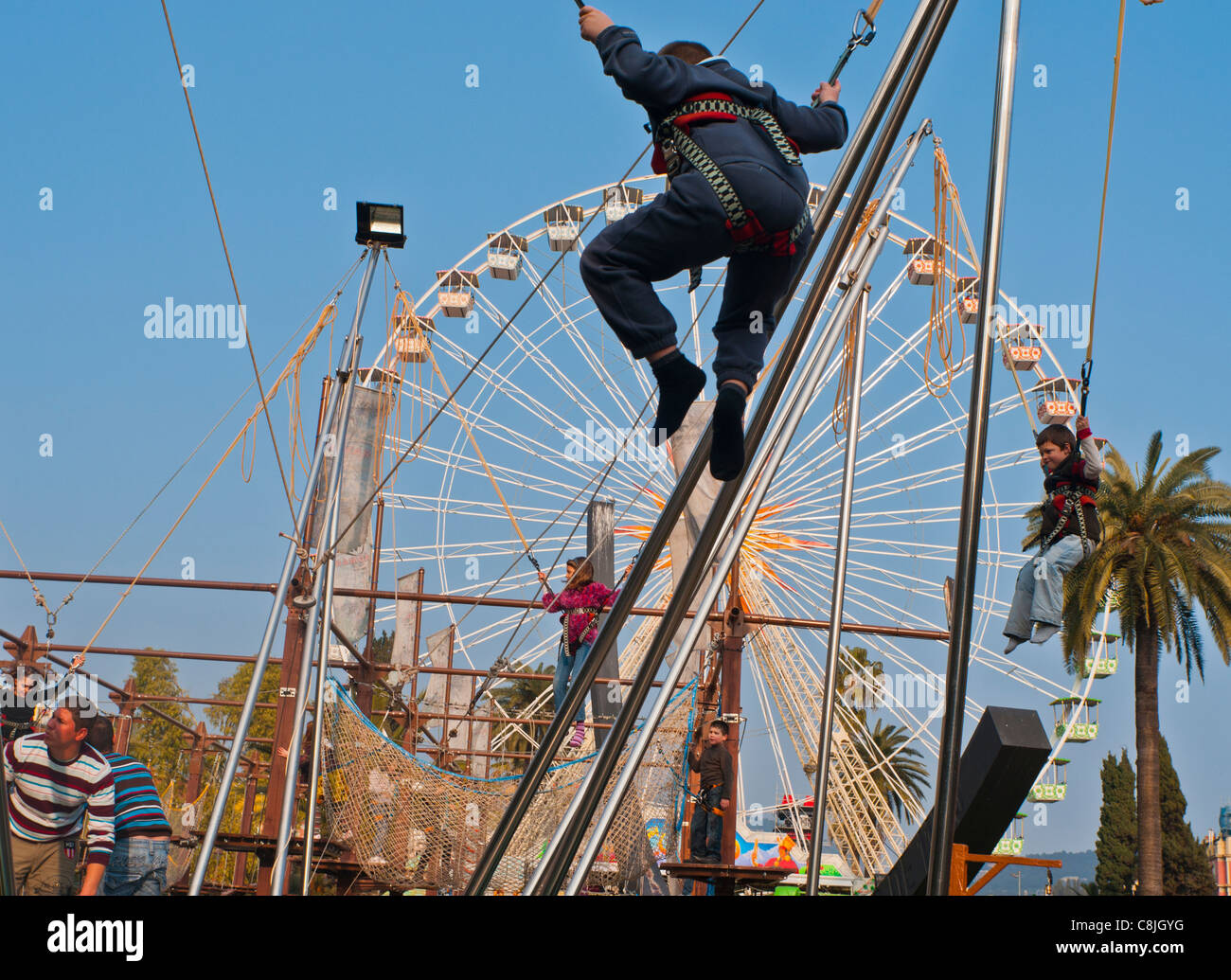 Nice, France, Children Enjoying Annual Carnival Rides on Street Stock