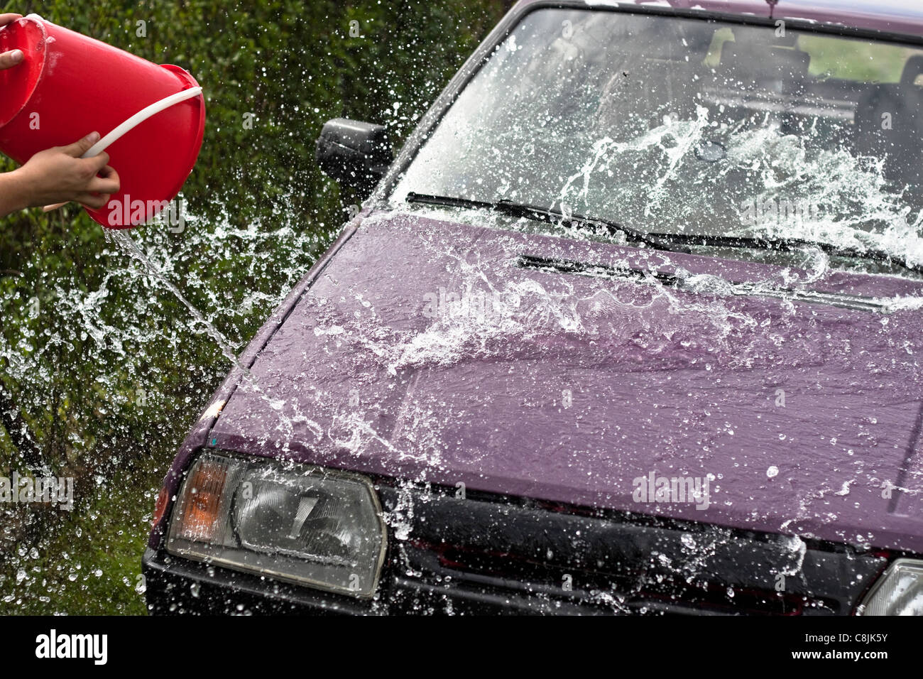 Pouring water bucket hires stock photography and images Alamy