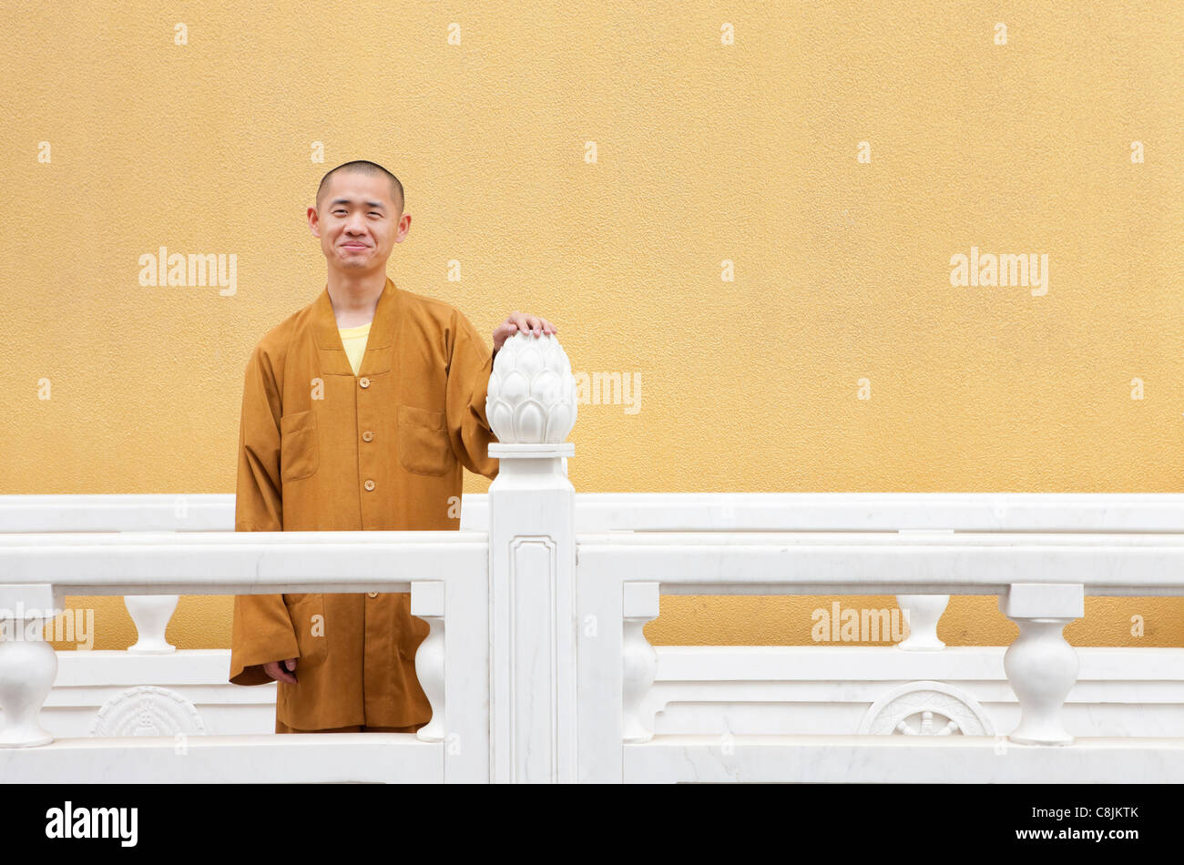 Monk wearing yellow, Jing'an temple; Shanghai; China Stock Photo