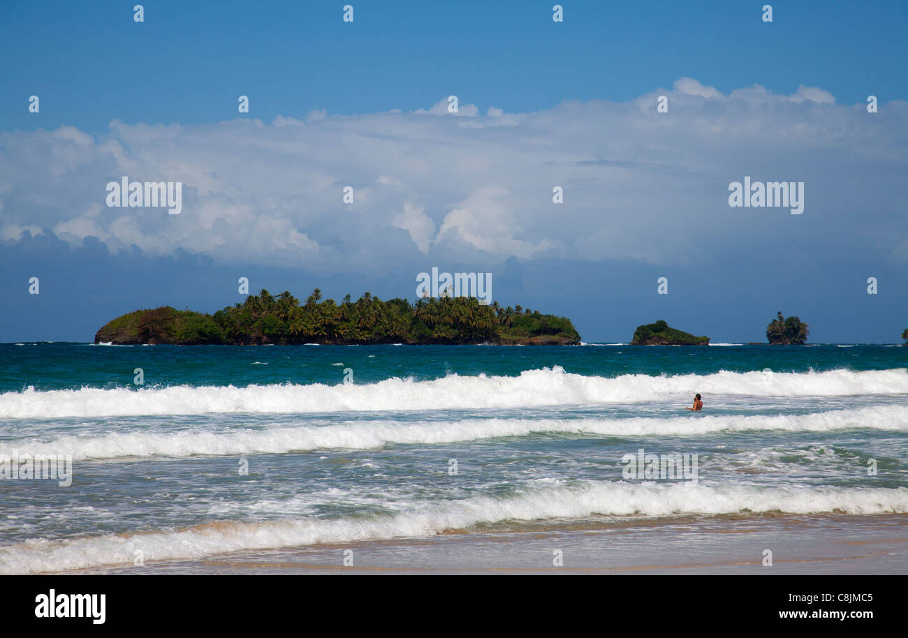 Holidaymaker in the surf at Playa Red Frog. Stock Photo