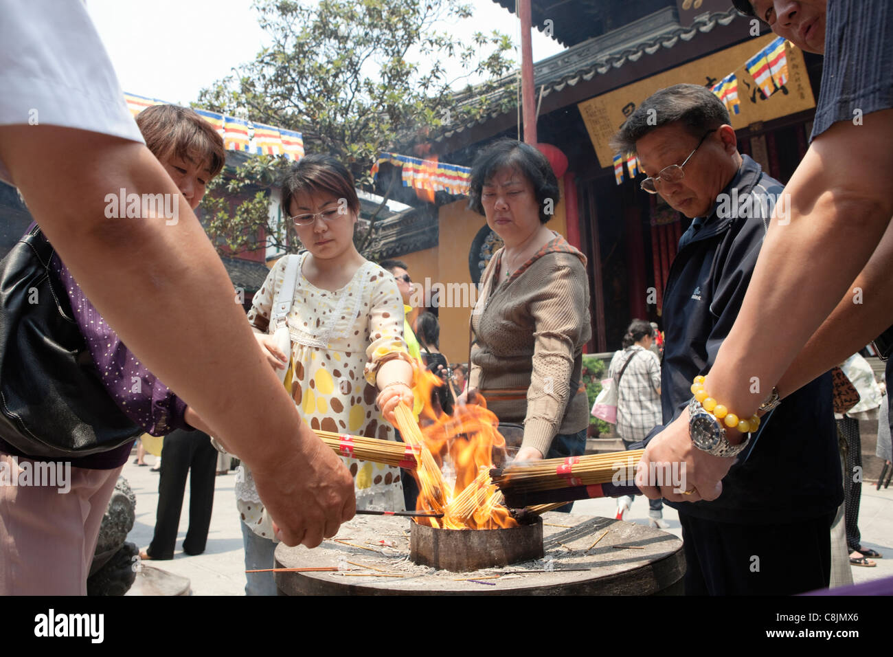 Lighting incense; Jade Buddha Temple; Shanghai; China Stock Photo