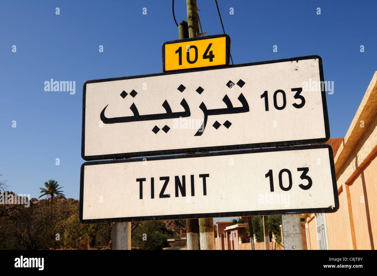 Bilingual Signpost Tiznit 103 Km, Tafraoute, Morocco Stock Photo