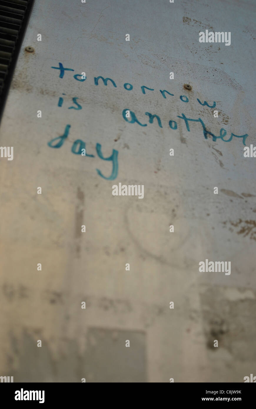 Grafitti on a wall reading 'tomorrow is another day' Stock Photo