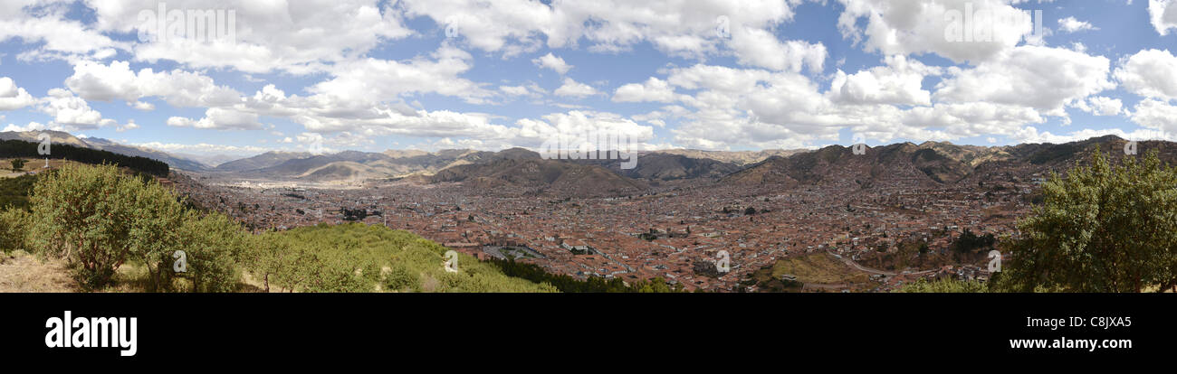 panorama slum roof red Cuzco Peru aerial tin roof orange shanty town sky blue cloud viewpoint overlooking tourism tourist cloudy Stock Photo