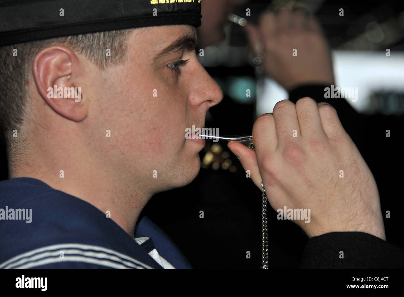 Piping aboard bosun's call whistle still used in the Royal Navy. UK