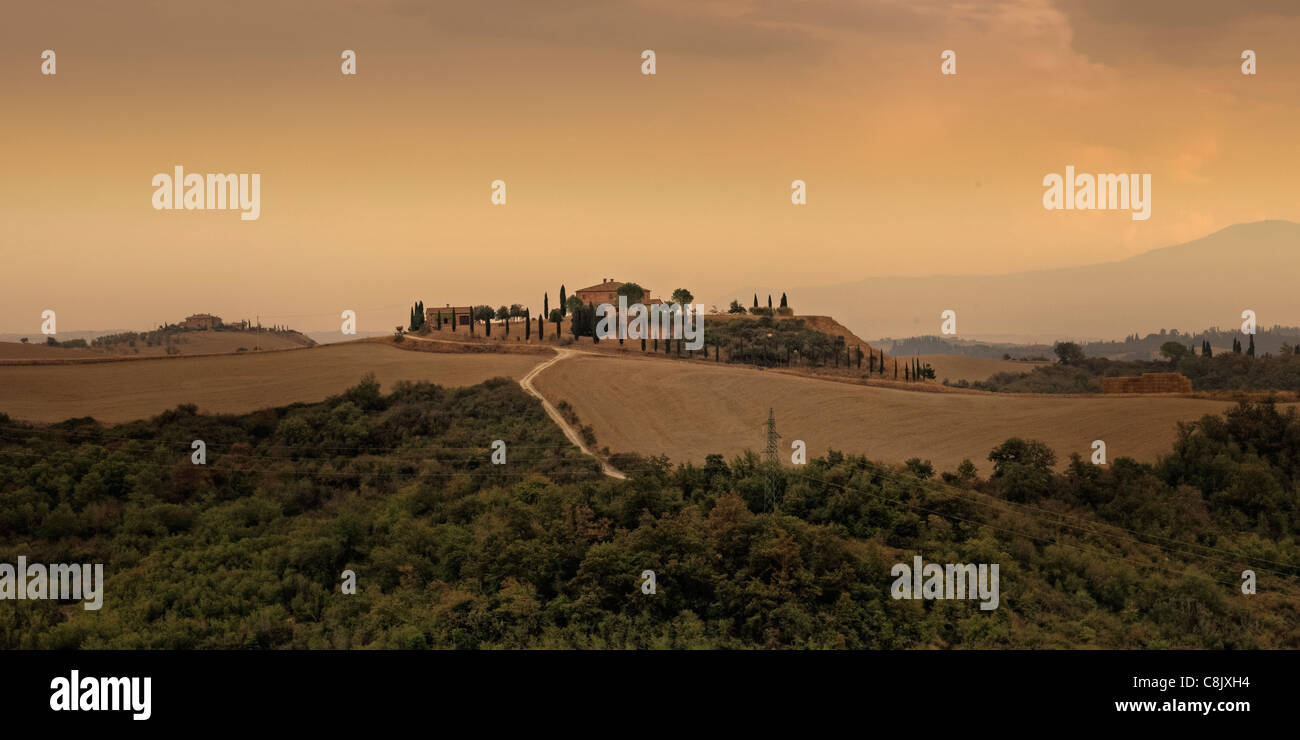 Rolling hills in Tuscany on a sunny day with dramatic clouds Stock Photo -  Alamy