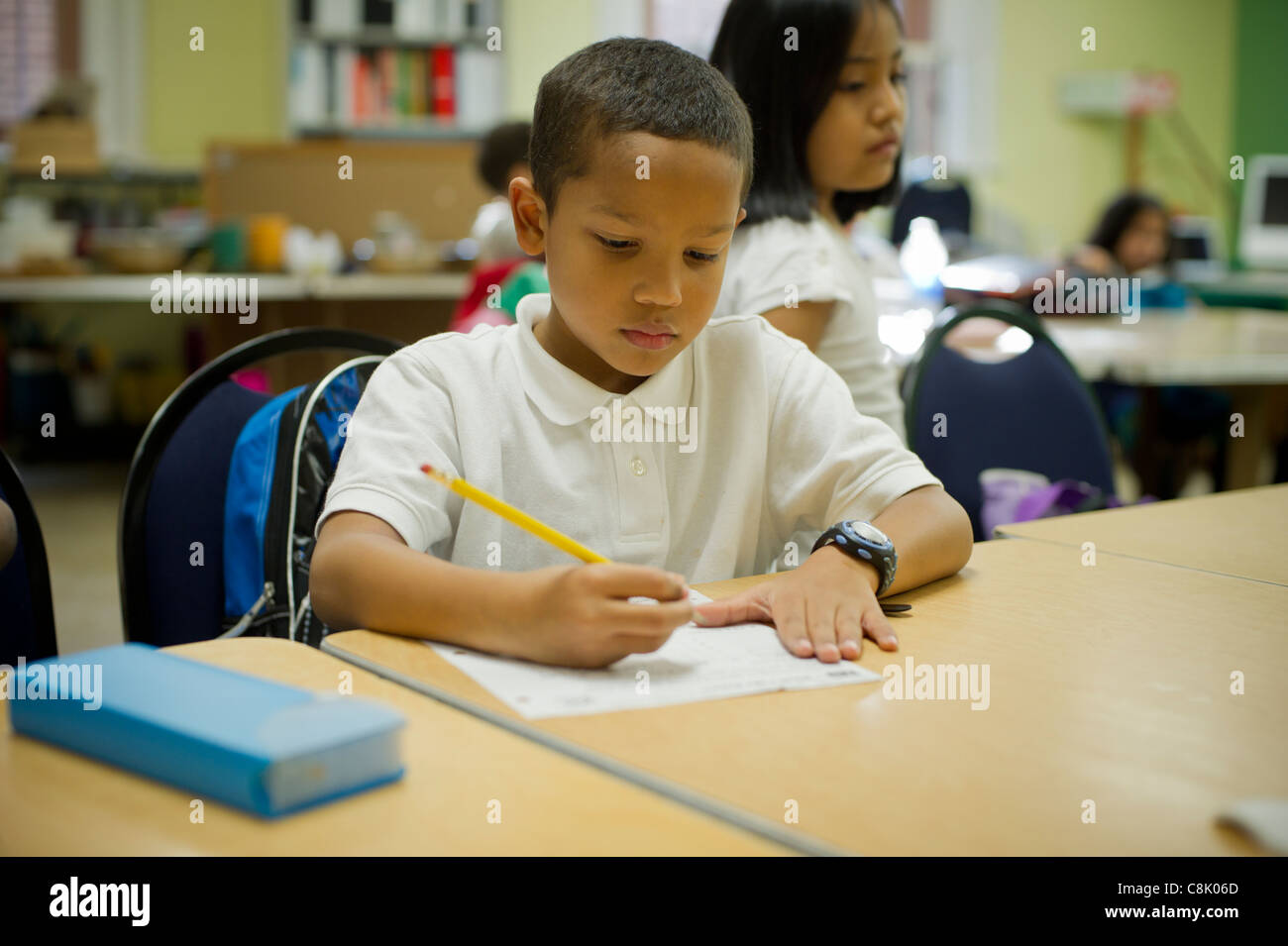second-and-third-graders-do-homework-during-an-after-school-program-in