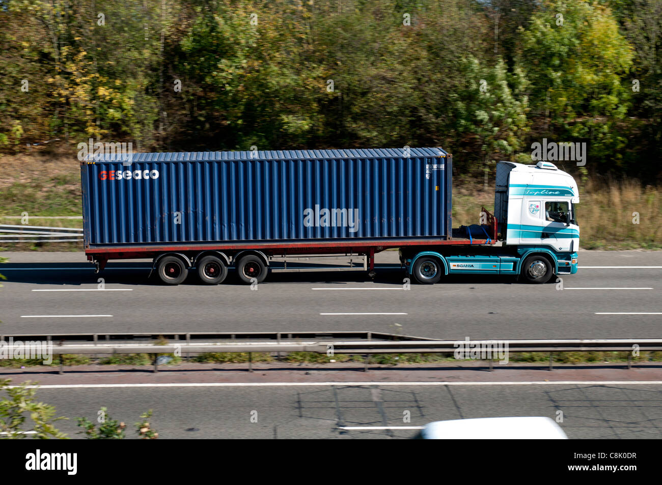 Shipping container lorry on M40 motorway, Warwickshire, UK Stock Photo