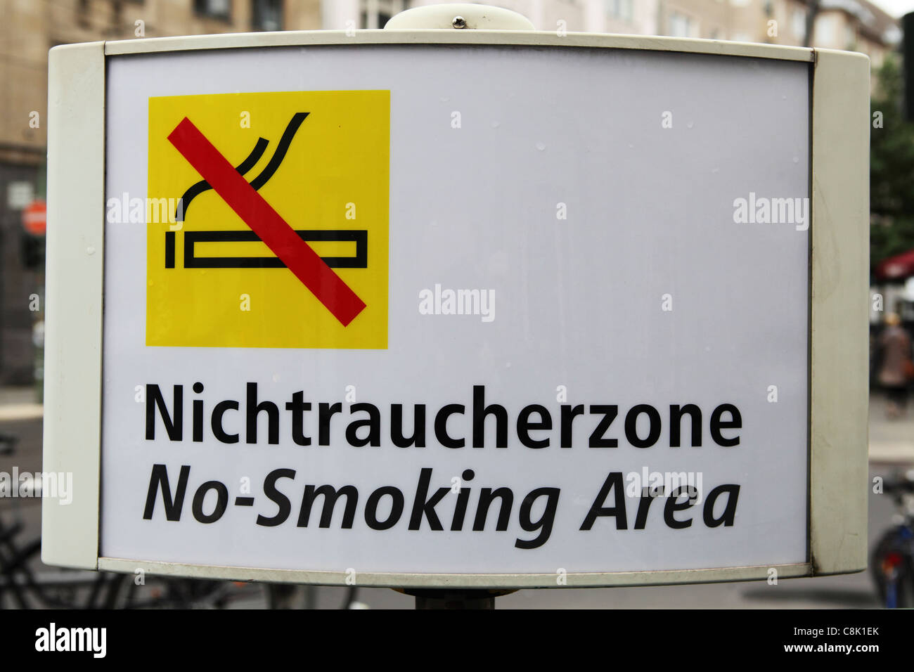 A bilingual sign for a No Smoking Area (Nichtraucherzone) in Berlin, Germany. Stock Photo