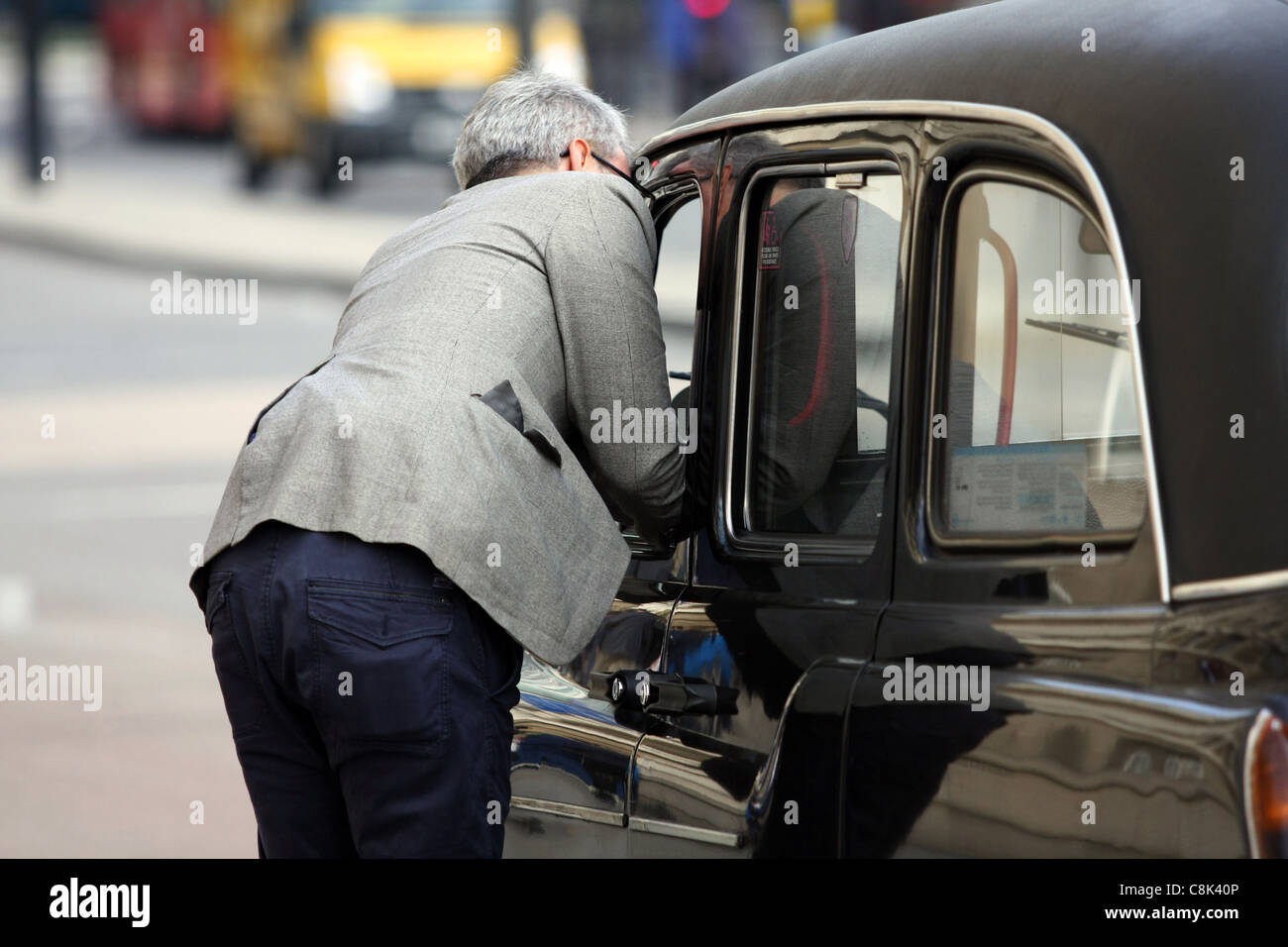 Talking taxi driver hires stock photography and images Alamy