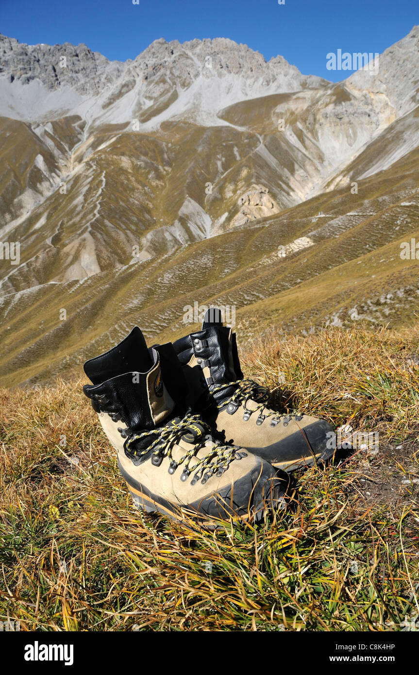Hiking Boots in front of Mountain Panorama, Margunet, Swiss National Park, Engadin, Graubünden, Switzerland Stock Photo
