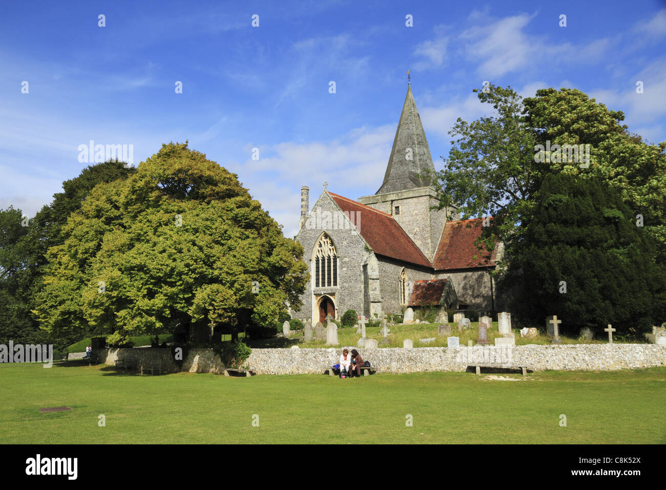 St Andrews Church overlooking the village green at Alfriston, East Sussex, England. Stock Photo
