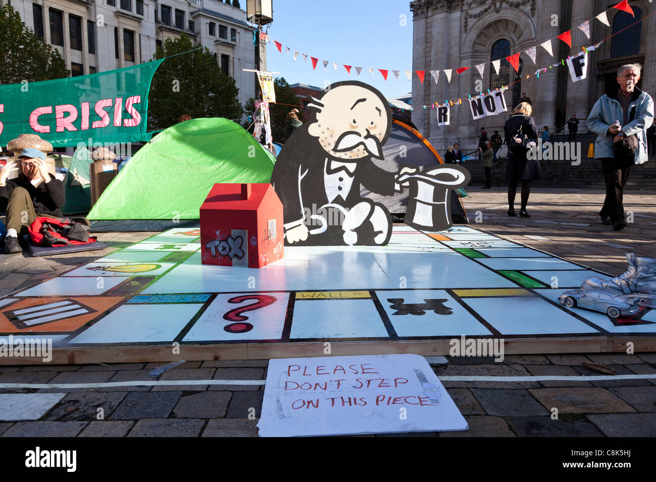 Mock monopoly game forms part of an anti-capitalist protest camp outside St Paul's Cathedral, London, October, 2011. Stock Photo