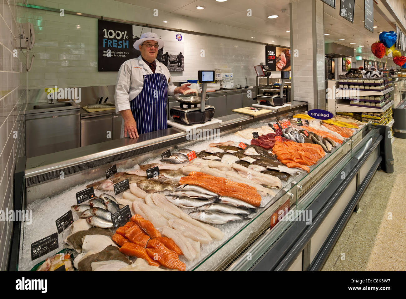 Fishmonger counter at a supermarket Stock Photo - Alamy