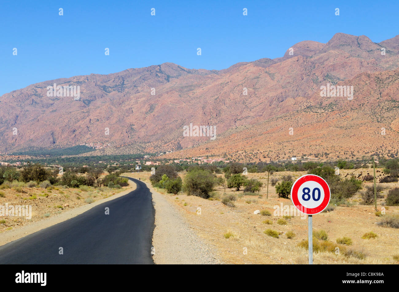 80 Kph Speed Limit sign on the road along the Ameln Valley near Tafraoute, Souss-Massa-Draa Region, Morocco Stock Photo