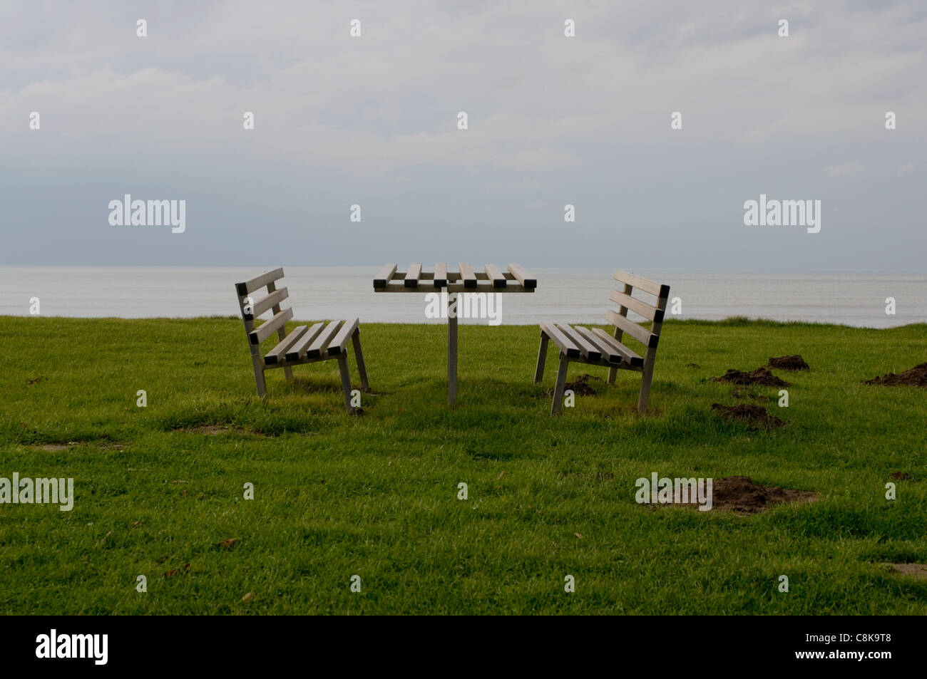 A picnic bench on a blustery day in Clarach near Aberystwyth. Stock Photo